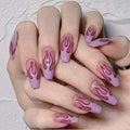 Wearing nails finished with purple matte false nails and red flame design